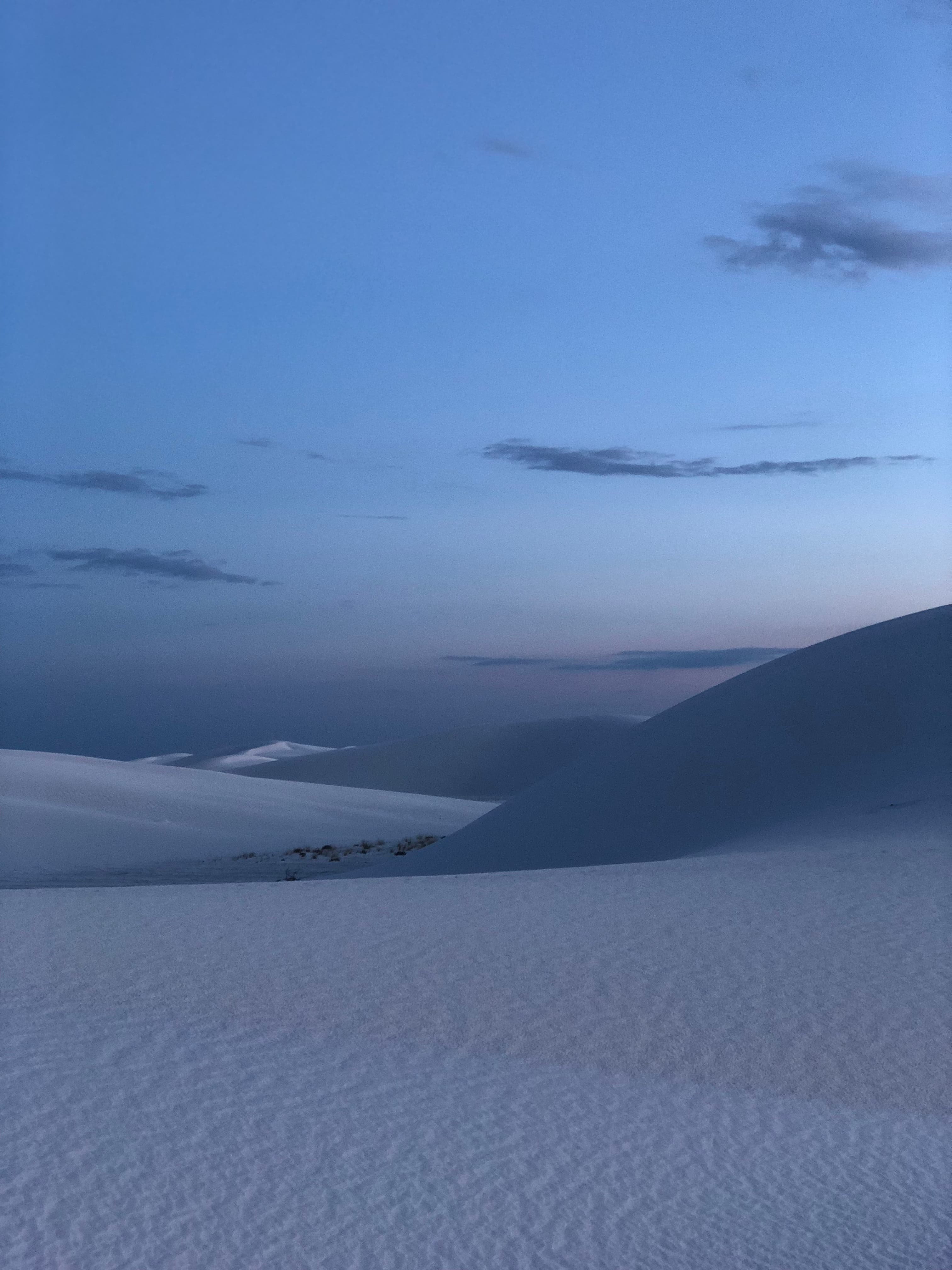 The dunes at twilight under a blue sky